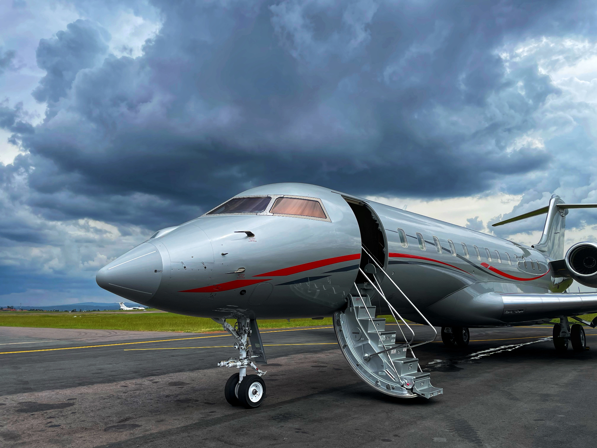 Global Express with airstairs under stormy skies
