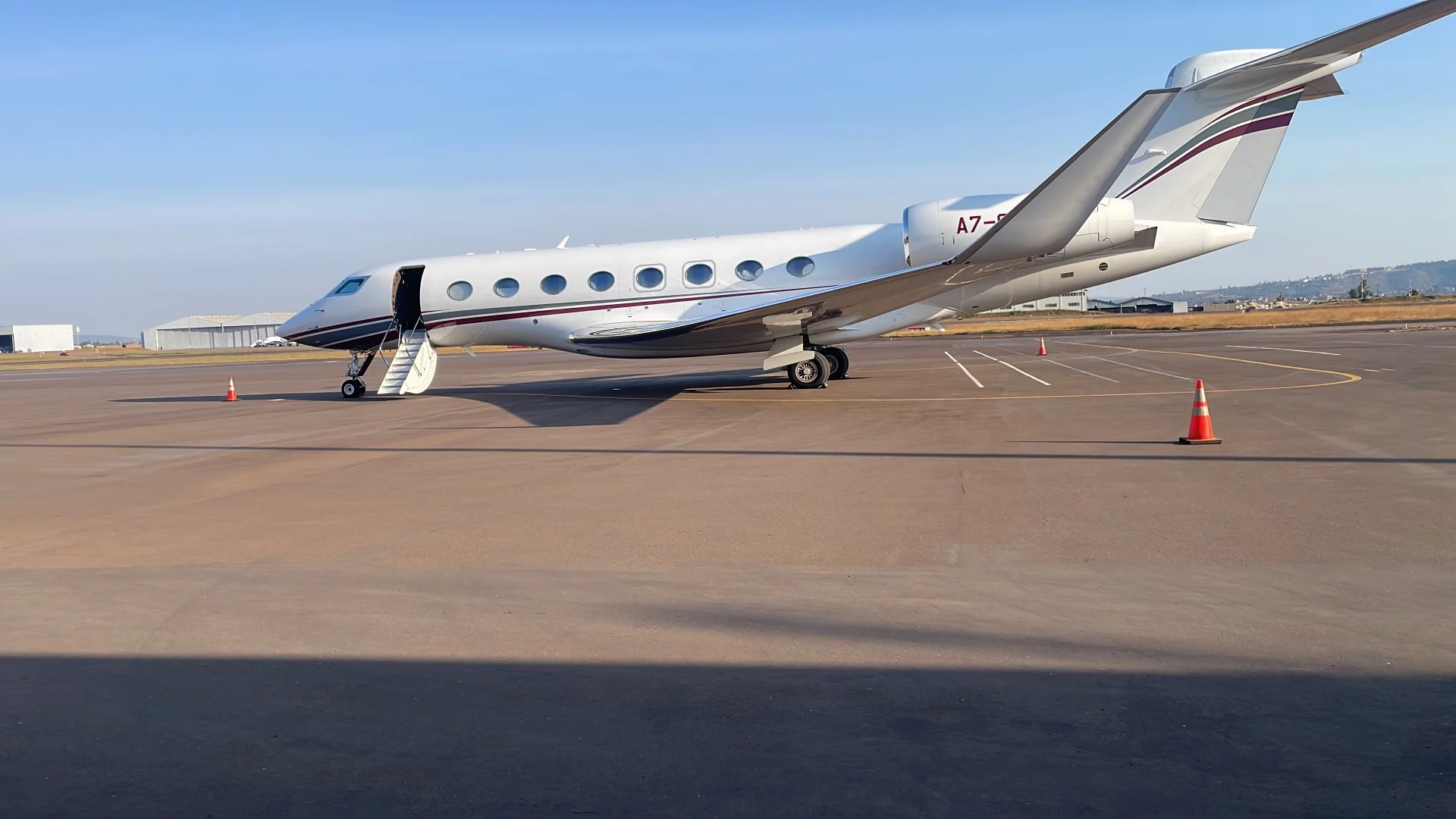 Gulfstream jet parked on sunny tarmac