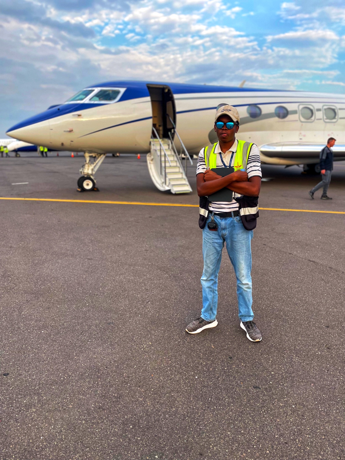 G.A.S. team member on ramp with private jet